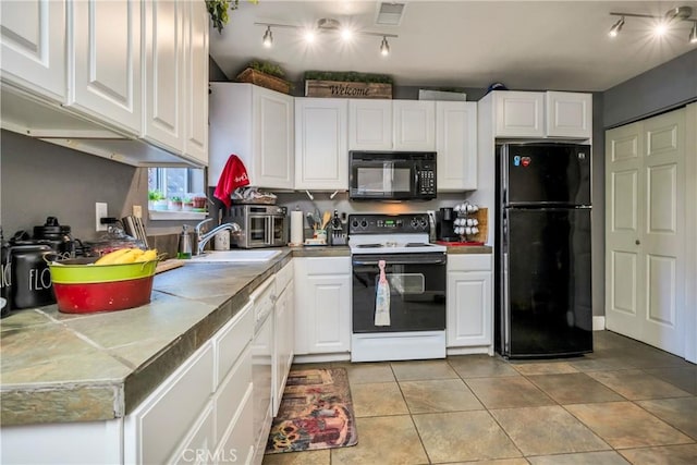 kitchen with white cabinetry, sink, track lighting, light tile patterned floors, and black appliances