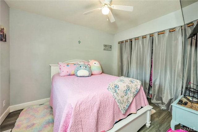 bedroom featuring ceiling fan and dark hardwood / wood-style floors