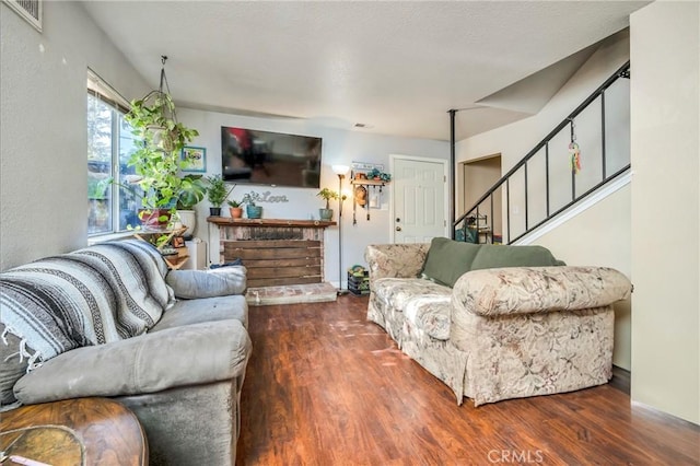 living room featuring dark hardwood / wood-style flooring