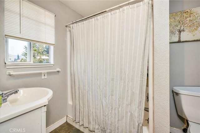 full bathroom featuring vanity, toilet, and shower / tub combo with curtain