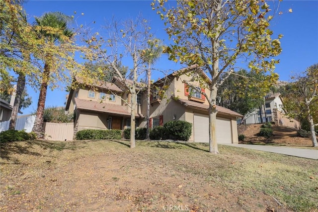 view of front facade with a garage and a front lawn