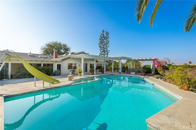 view of pool featuring a pergola and a water slide