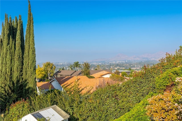 birds eye view of property with a mountain view