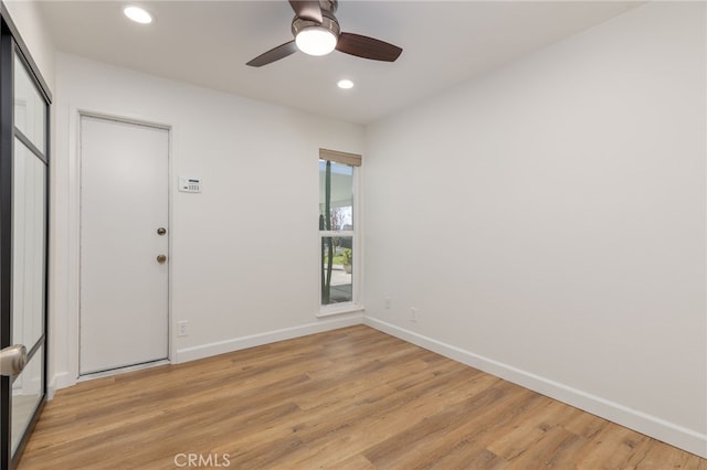 foyer featuring ceiling fan and light hardwood / wood-style flooring