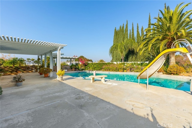 view of swimming pool with a pergola and a patio