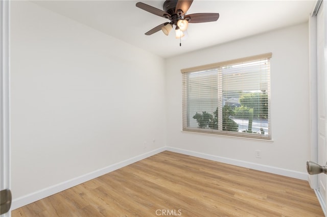 spare room featuring ceiling fan and light hardwood / wood-style floors