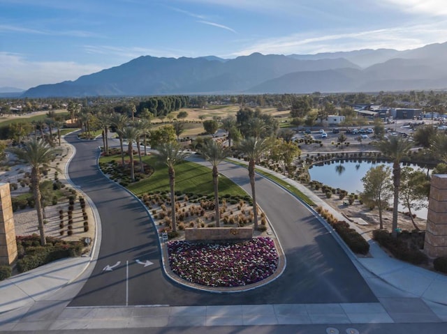 exterior space featuring a water and mountain view