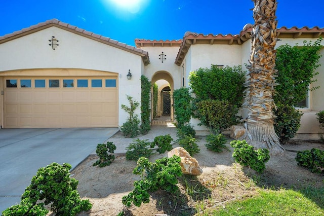 mediterranean / spanish-style home featuring a garage