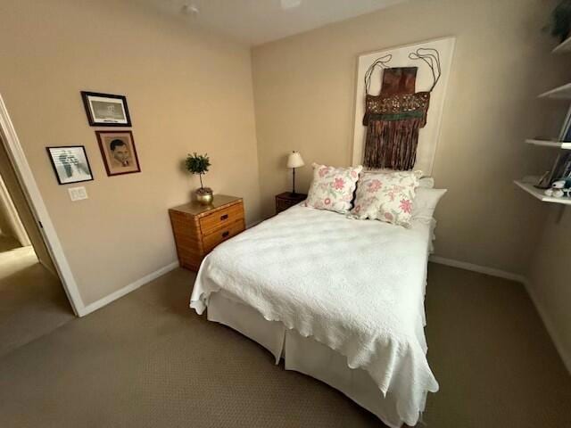 bedroom with dark colored carpet