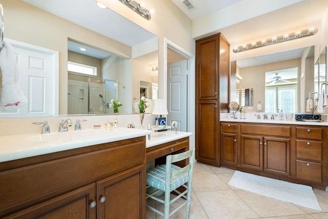 bathroom with vanity, tile patterned floors, ceiling fan, and walk in shower