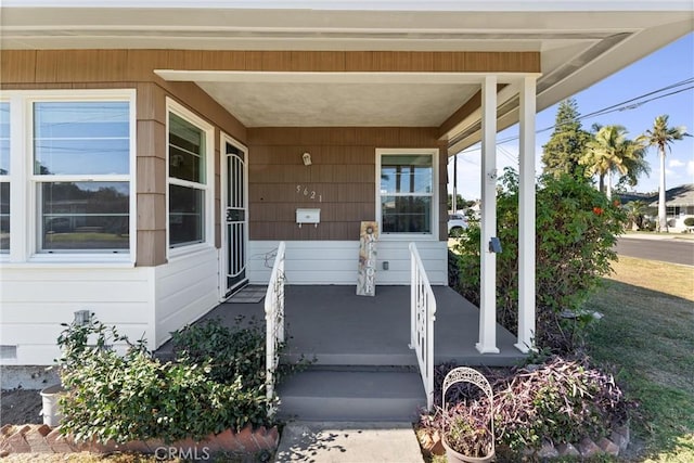 entrance to property featuring covered porch