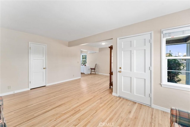 spare room featuring light hardwood / wood-style floors