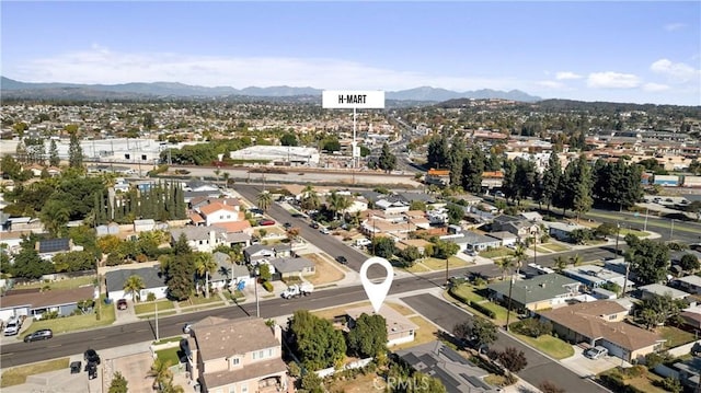 birds eye view of property with a mountain view