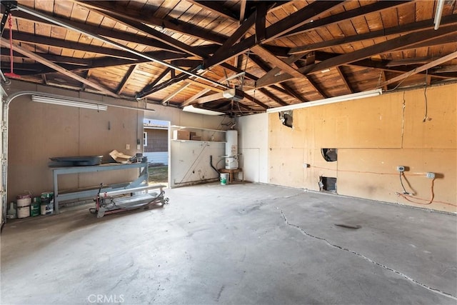 garage with strapped water heater, a garage door opener, and wooden ceiling