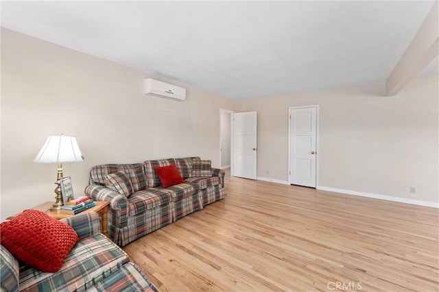 living room featuring a wall mounted air conditioner and light wood-type flooring