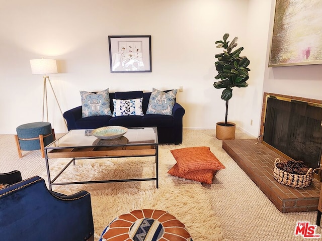 living room featuring carpet flooring and a fireplace