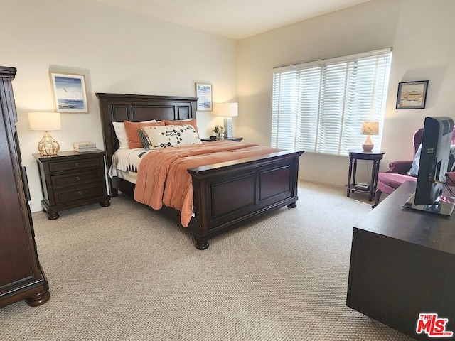 bedroom with light carpet