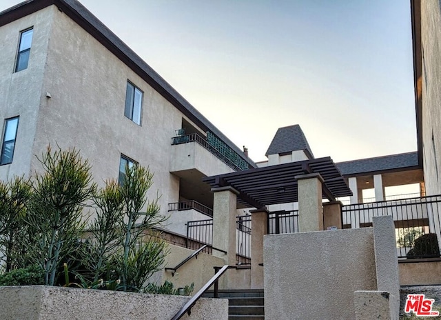 view of outdoor building at dusk