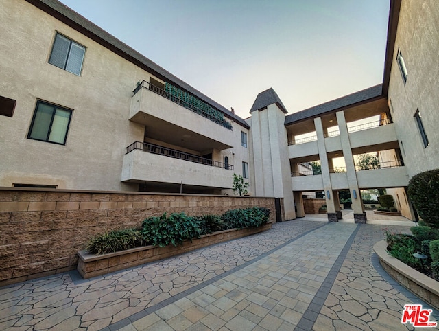 view of outdoor building at dusk