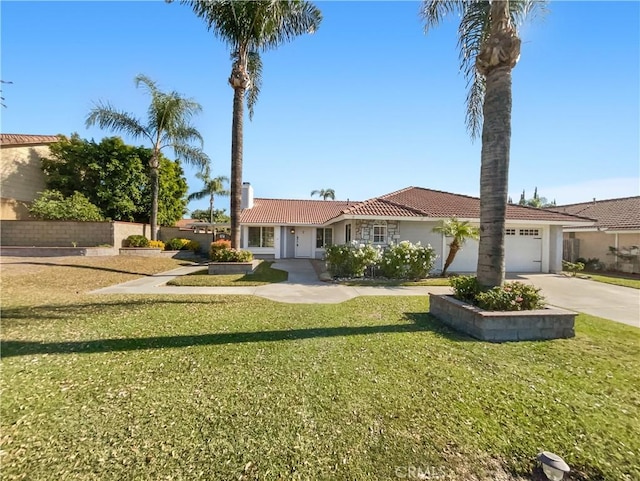 view of front of house with a garage and a front yard