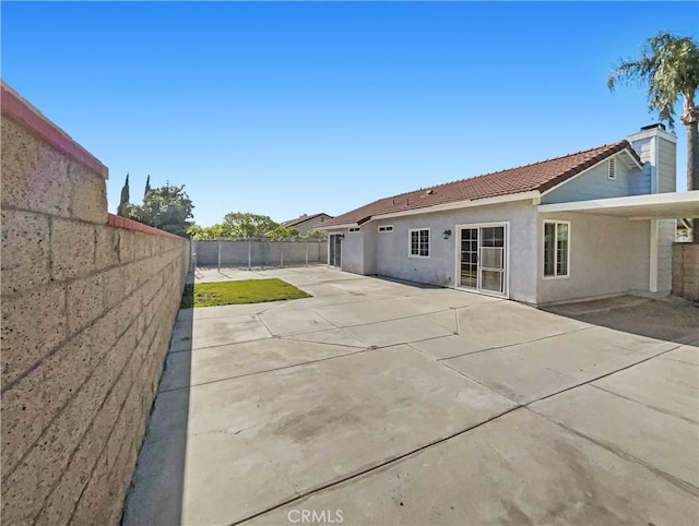 rear view of property with a patio area