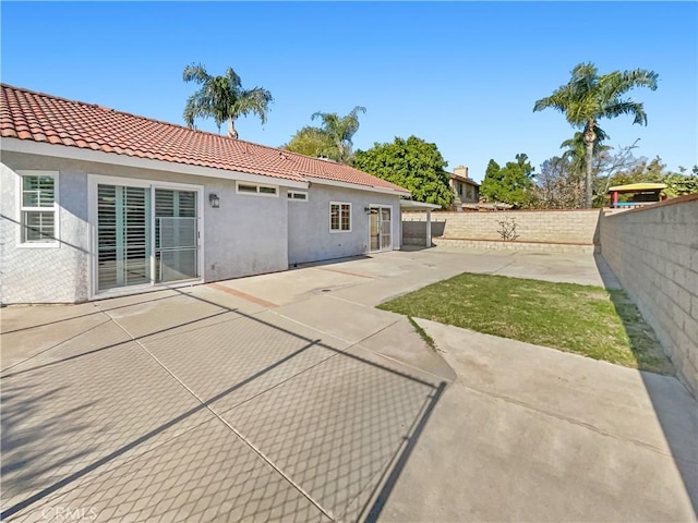 rear view of house with a patio