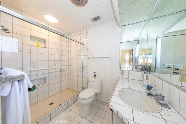 full bathroom featuring wallpapered walls, visible vents, toilet, tile patterned floors, and a shower stall