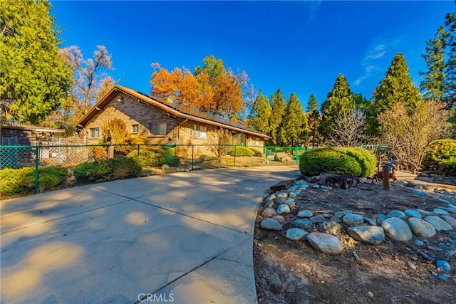 view of front of home featuring fence