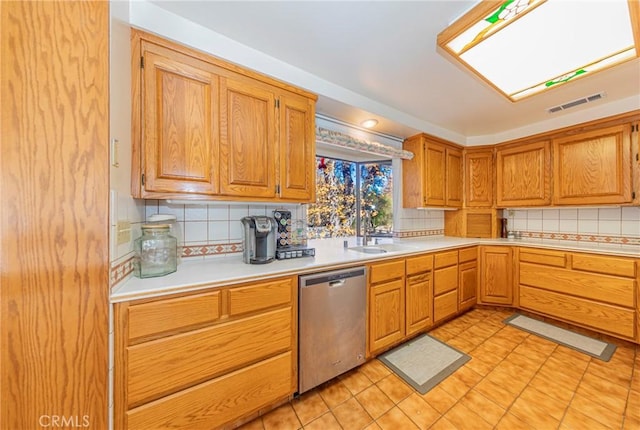 kitchen featuring a sink, visible vents, light countertops, and stainless steel dishwasher