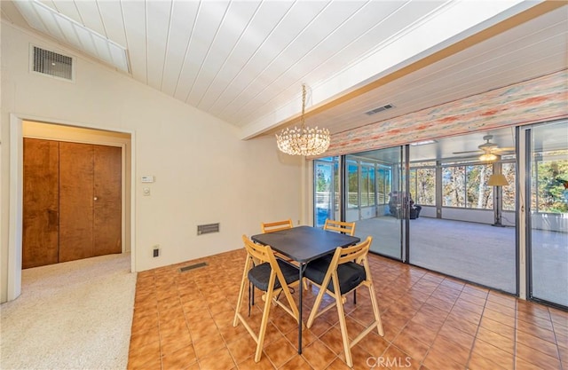 dining space featuring lofted ceiling, tile patterned flooring, visible vents, and an inviting chandelier