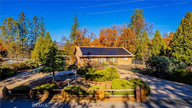 view of front of home with solar panels