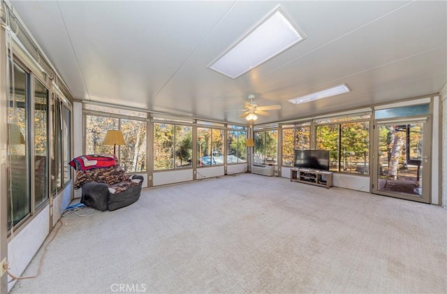 sunroom featuring ceiling fan