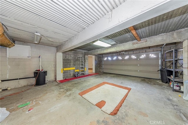 garage with concrete block wall