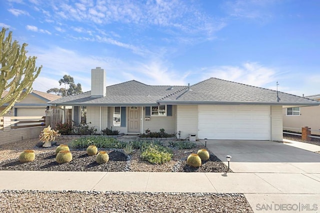 ranch-style house featuring a garage