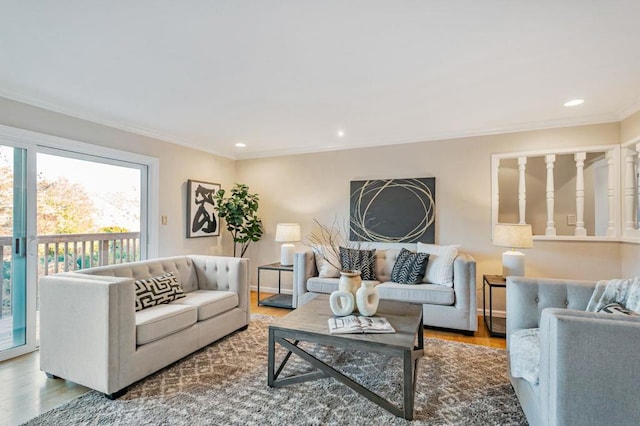 living room with crown molding and hardwood / wood-style flooring