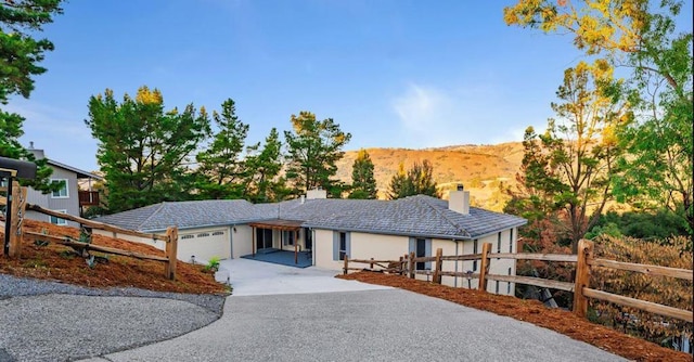 view of front of house featuring a mountain view and a garage