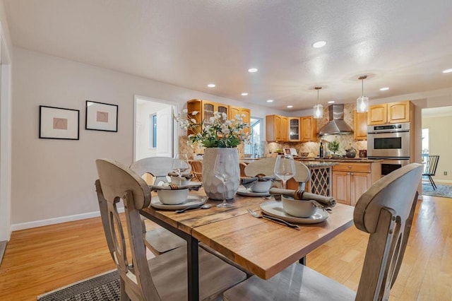 dining room with light hardwood / wood-style floors