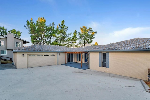 single story home featuring a garage