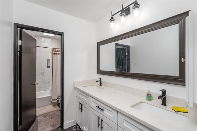 bathroom with shower / bath combo and vanity