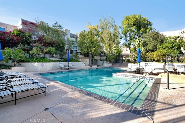 view of swimming pool with a patio