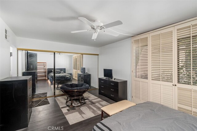 bedroom featuring ceiling fan and dark hardwood / wood-style floors