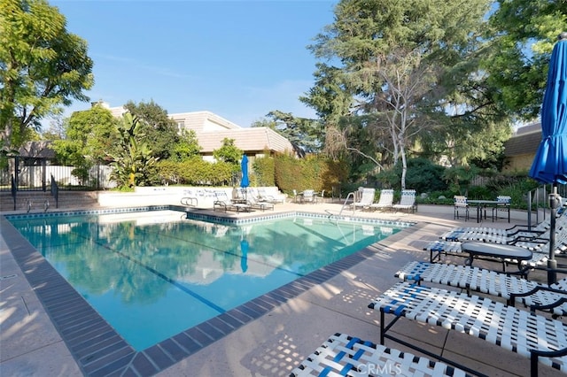 view of swimming pool featuring a patio area