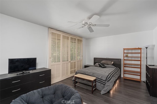 bedroom featuring ceiling fan and dark hardwood / wood-style floors