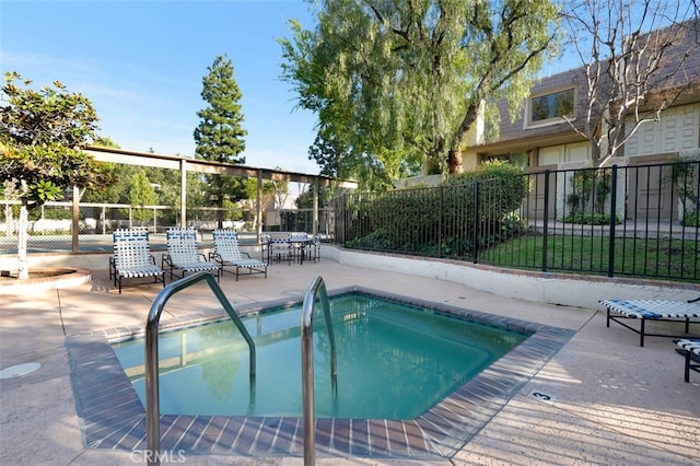 view of pool with a patio area and a community hot tub