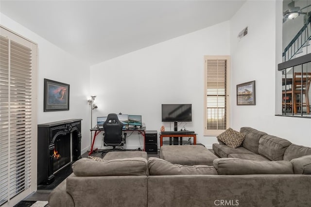 living room featuring lofted ceiling