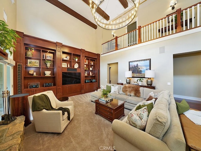 living room featuring carpet flooring, a high ceiling, and an inviting chandelier