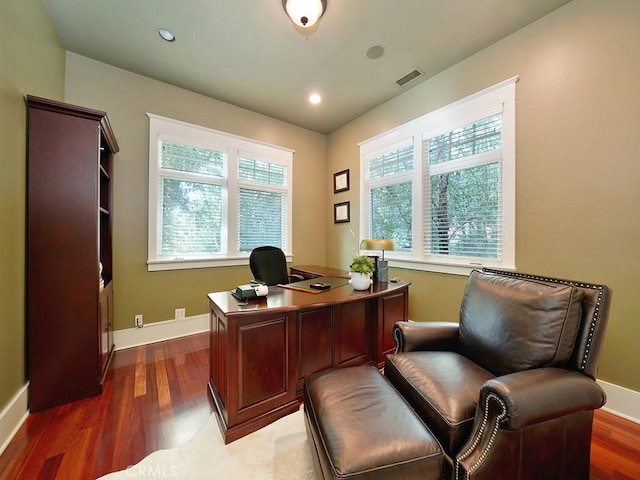 office with dark wood-type flooring