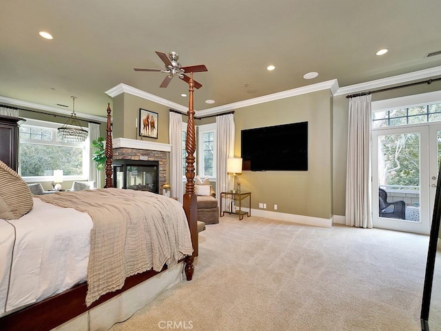 bedroom featuring access to outside, multiple windows, and ornamental molding