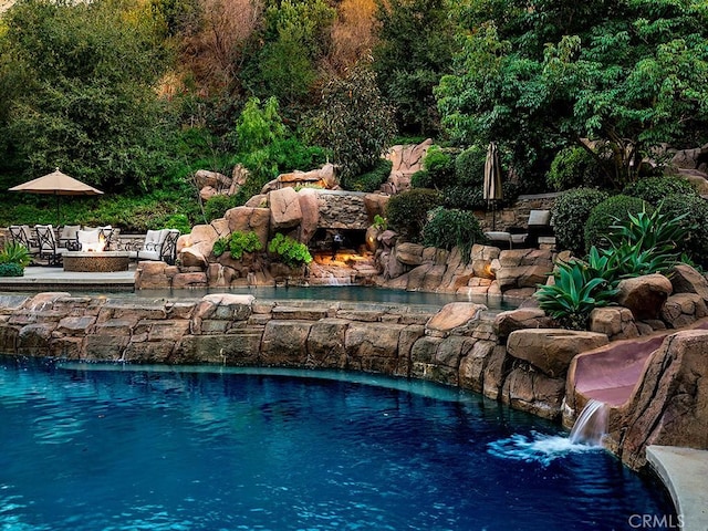 view of pool featuring pool water feature