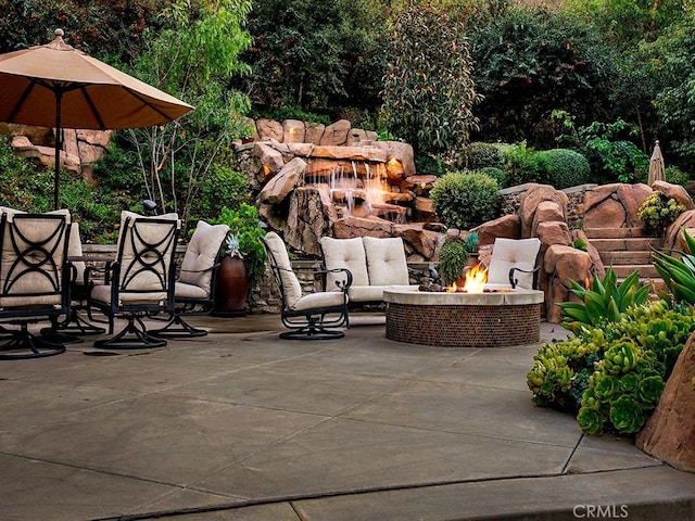 view of patio / terrace featuring a fire pit